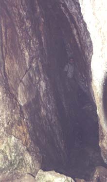 Tom inside narrow slab cave (photo by webmaster)