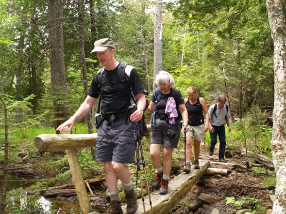 Mark, Deb, Donna, and Tom crossing a bridge between Gilmore Peak and Sargent Mtn. (photo by Webmaster)