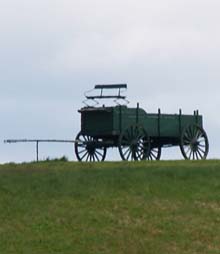 View up to the wagon from the gravel road (photo by Webmaster)
